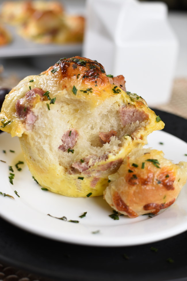 The inside of baked breakfast monkey bread wth diced ham and cheese
