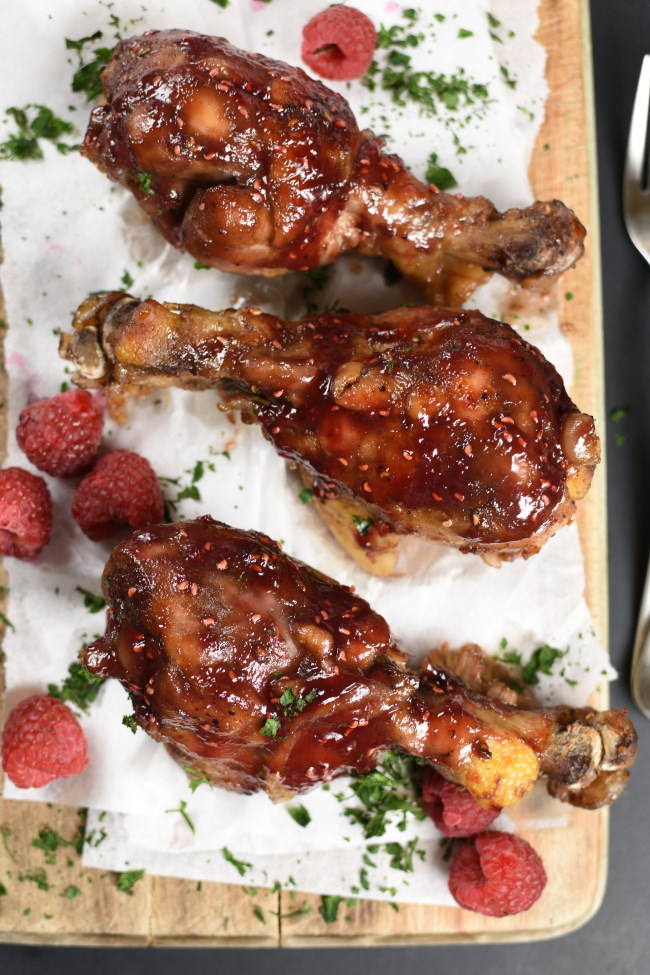 glazed chicken drumsticks with fresh raspberries