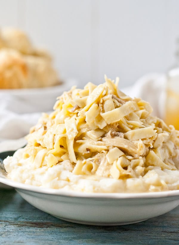 A plate piled high with noodles and chicken in creamy sauce