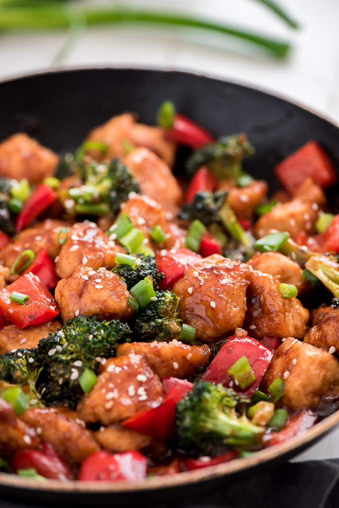 chicken, brocolli, and red peppers in a skillet 