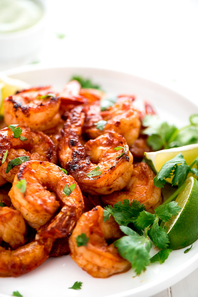 a plate with cooked grilled sprinkled with cilantro 