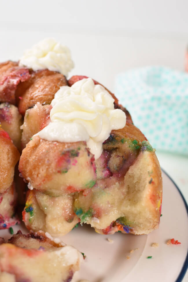 baked confetti bread piped with white frosting