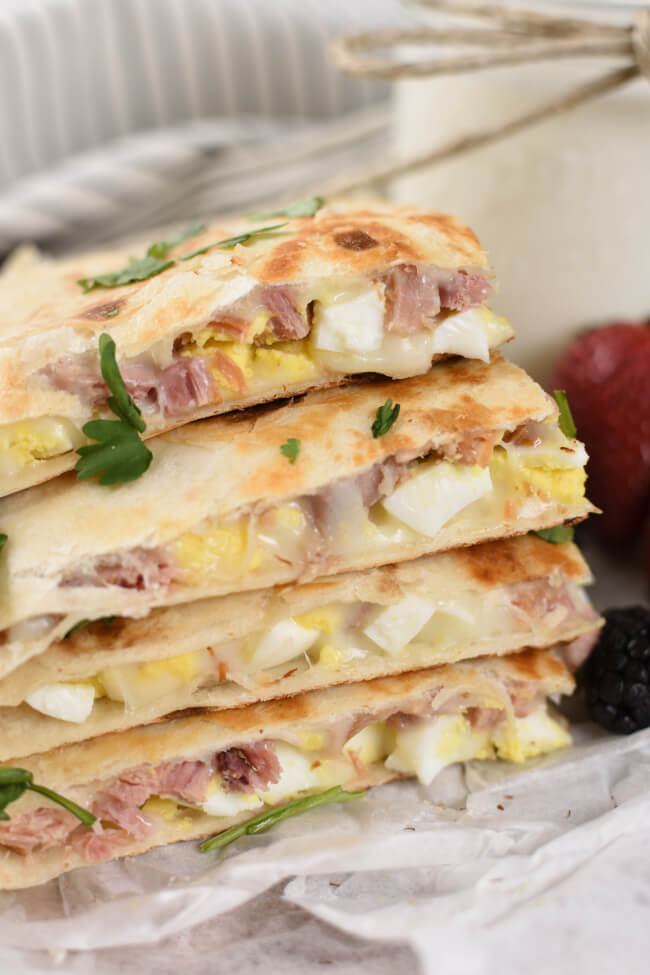 a stack of golden brown quesadillas with melted cheese