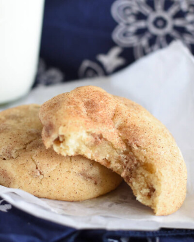 two baked snickerdoodle cookies on a white paper