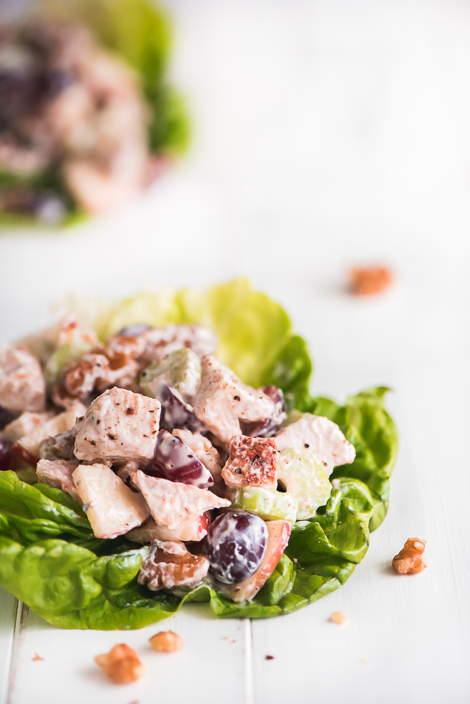 leaves of lettuce topped with chicken waldorf salad