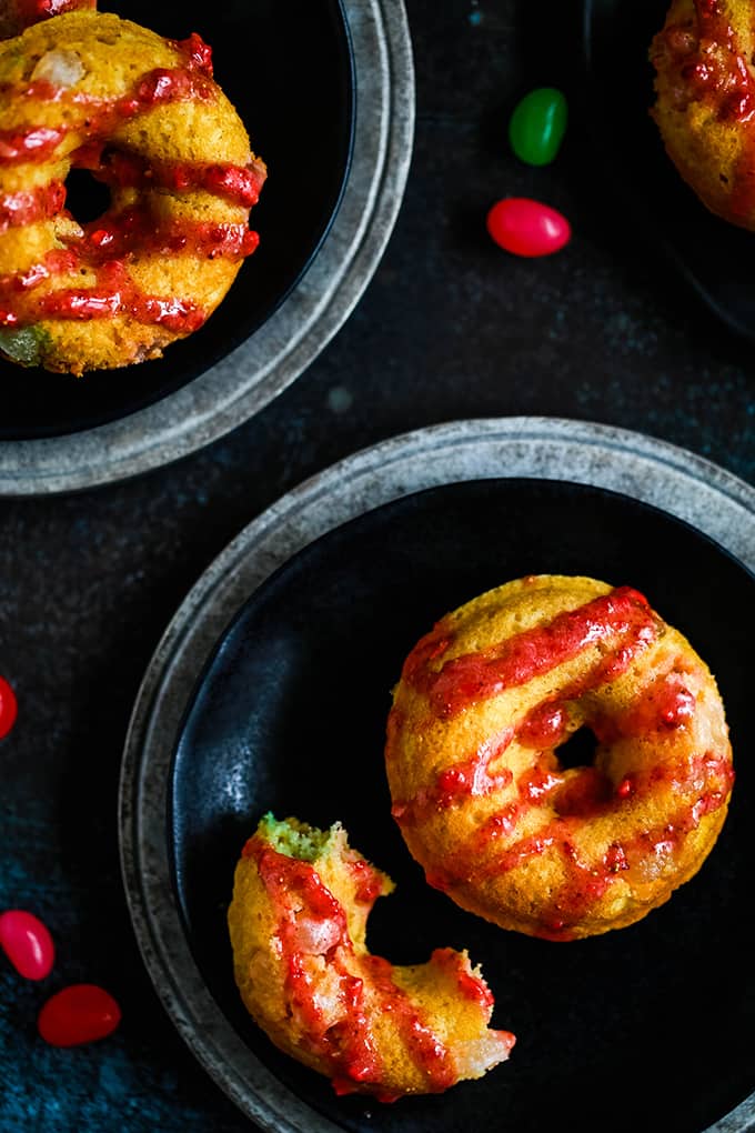 doughnuts drizzled with red icing, and stuffed with jelly beans