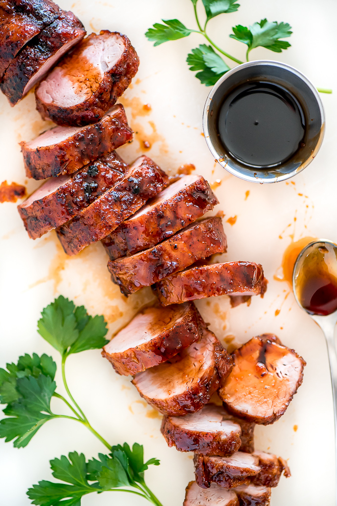 thick slices of pork tenderloin brushed with red glaze
