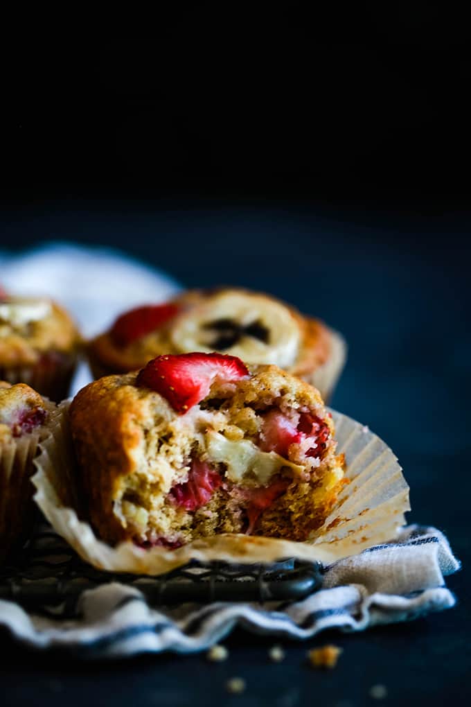 a muffin with strawberries on a white muffin wrapper