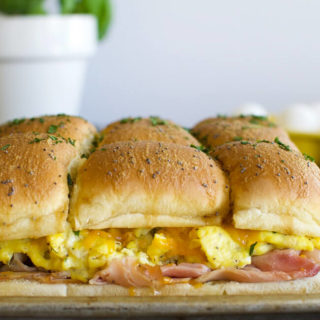 a sheet pan with baked breakfast sliders made on rolls