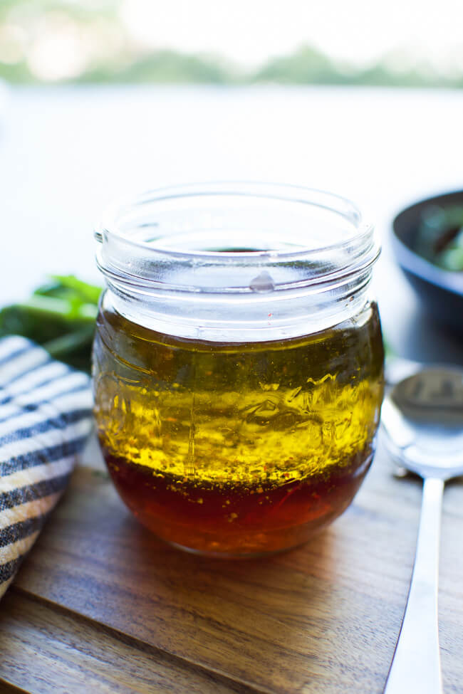 A glass jar with vinaigrette