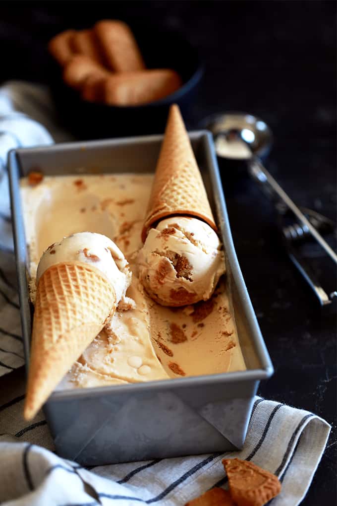 a bread pan with two ice cream cones filled with ice cream