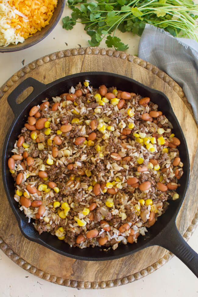 ground beef and bean burrito filling in a cast iron skillet