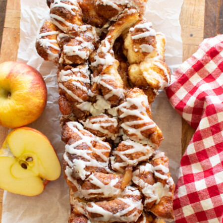 stressel topped apple pull apart bread on a bread board