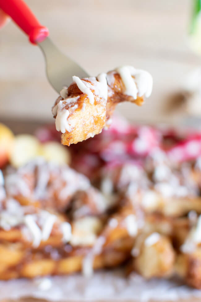 a bite of apple pull apart bread on a red fork