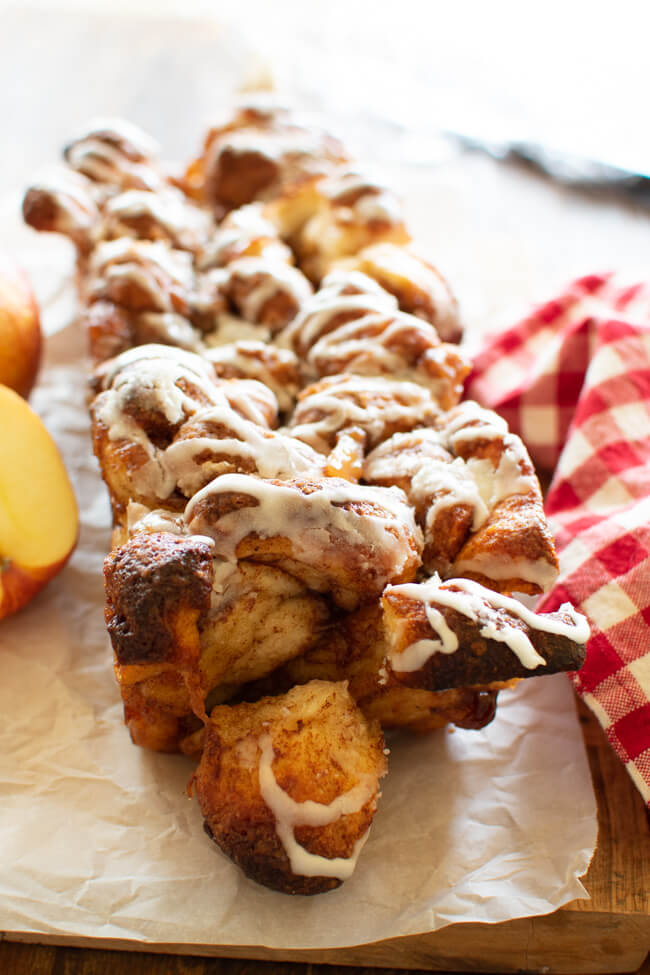 a loaf of apple bread with streusel and frosting