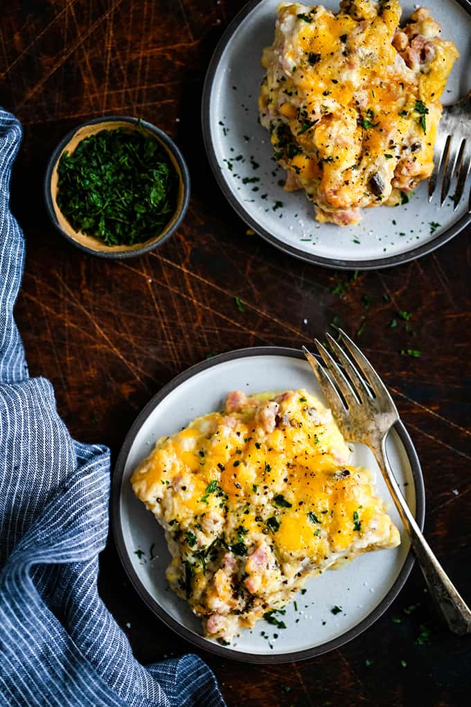 two plates with cheesy baked egg casserole