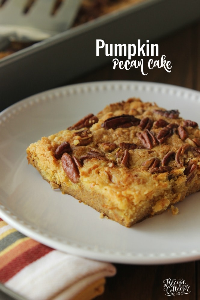 a square of pumpkin cake topped with crumbs and pecan chunks