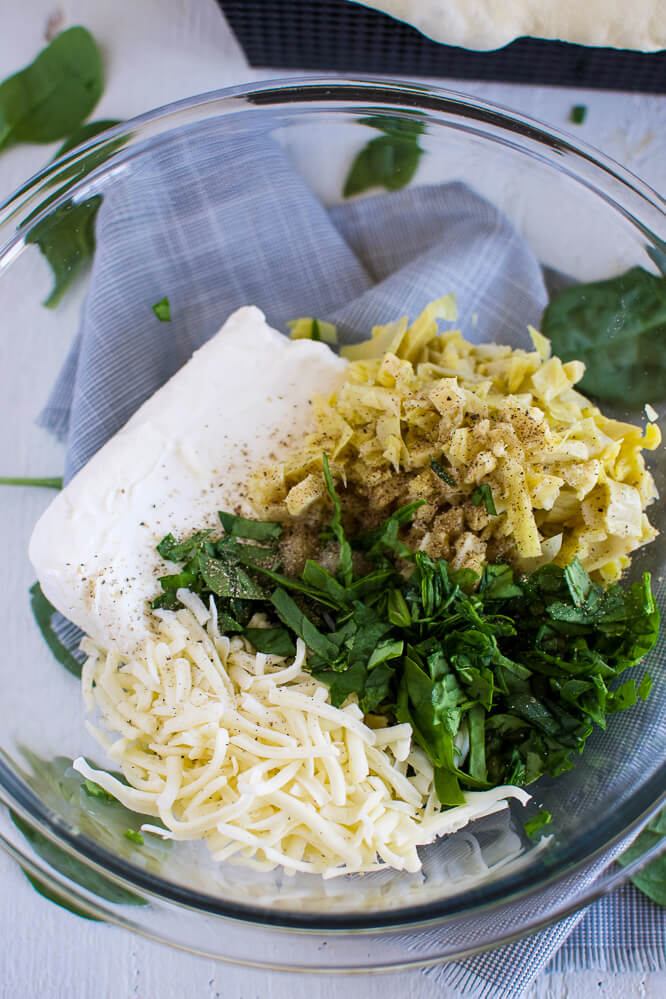 ingredients for spinach artichoke dip; cream cheese, mozzarella cheese, spinach, artichokes, salt, pepper, garlic, and mayonnaise