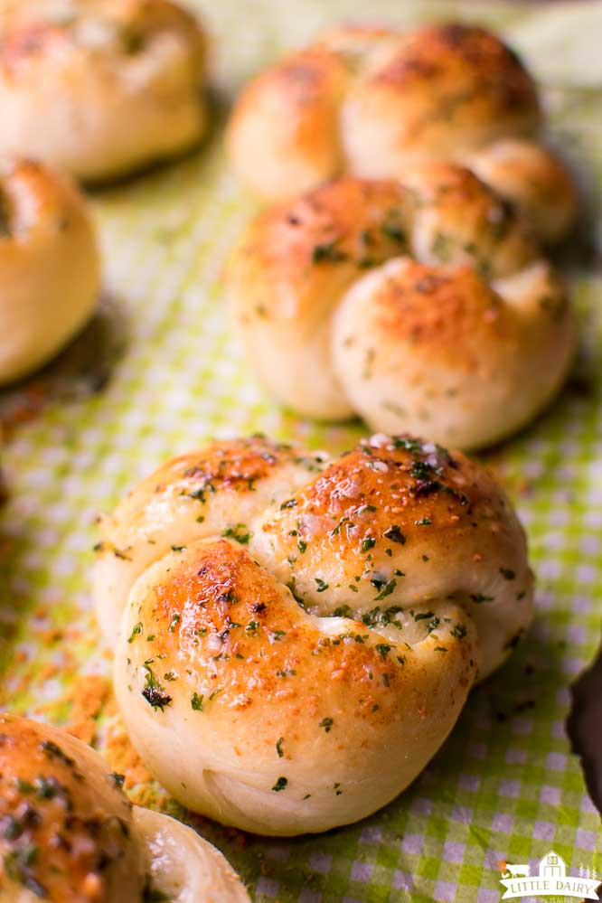 a close up image of a baked garlic bread knot