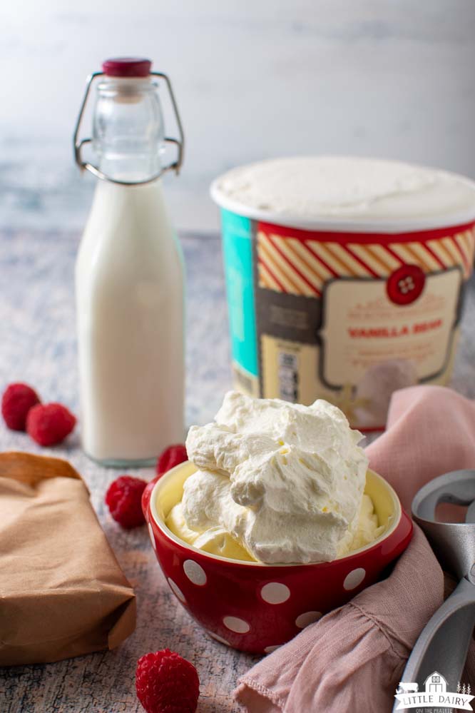 ingredients needed to make a milkshake; vanilla ice cream, milk, and jello, with whipped cream