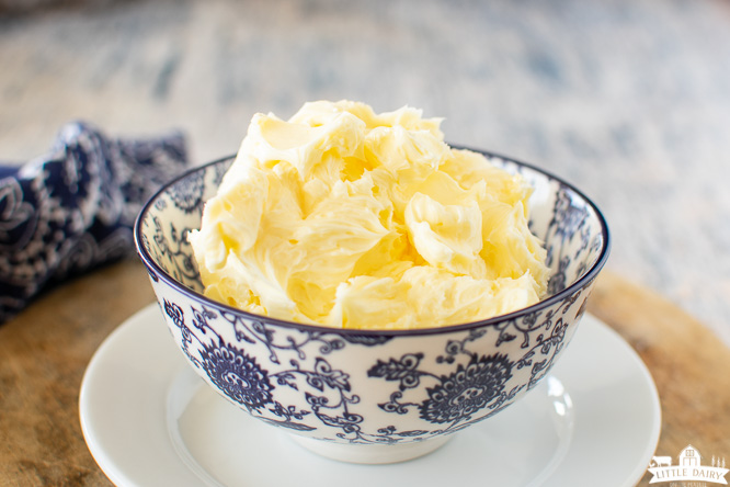 a blue floral bowl filled with whipped butter
