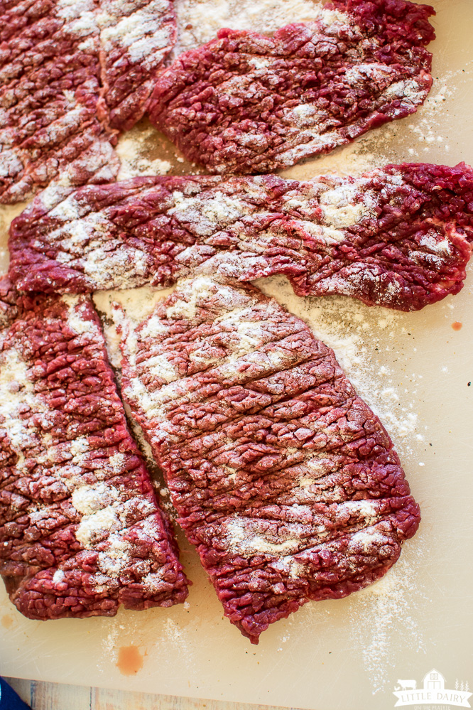 an image showing how to tenderize cube steaks with flour