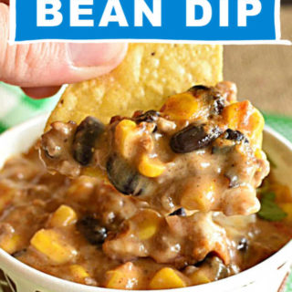 a paper cup with dip made with beans, corn, and ground beef with chips and a text overlay