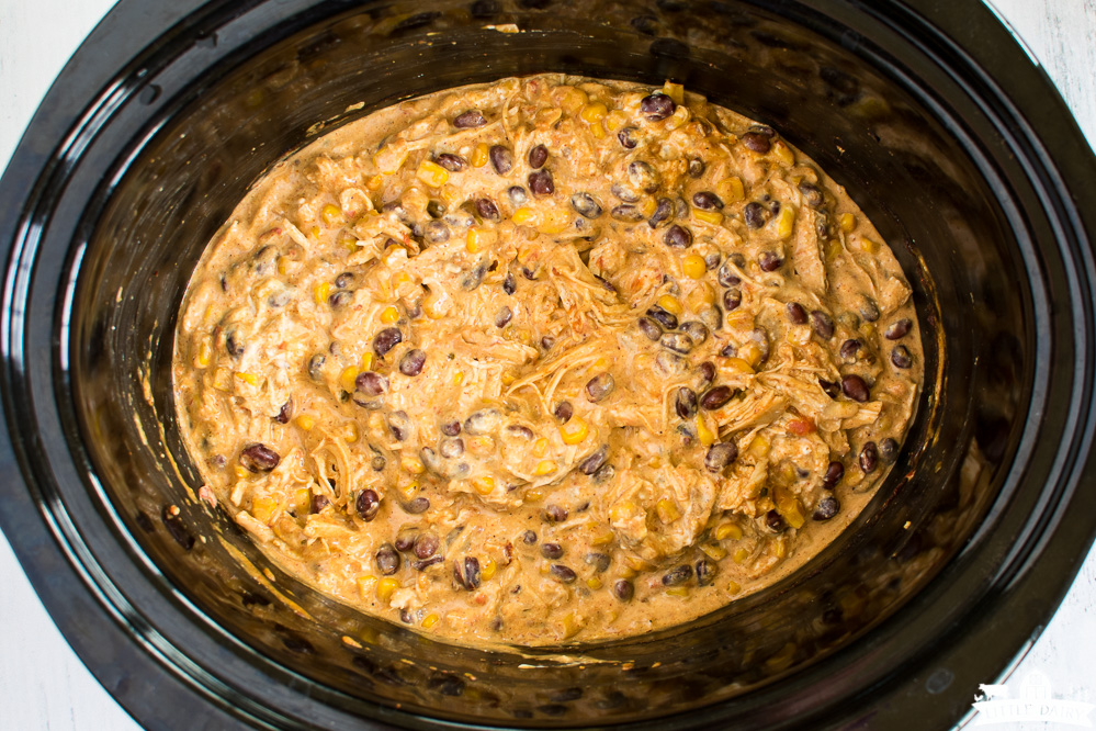 slow cooker with creamy shredded chicken with corn and beans