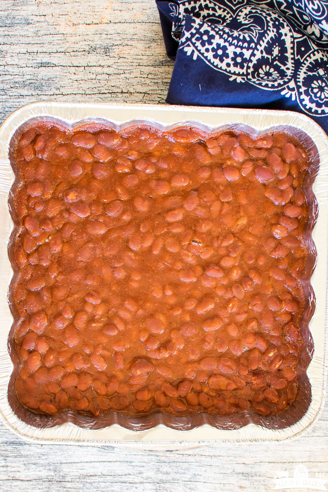 smoked baked beans in an aluminum pan