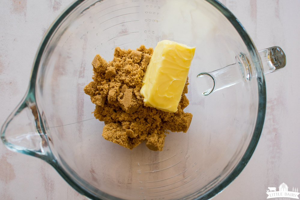 brown sugar and a cube of butter in a glass mixing bowl