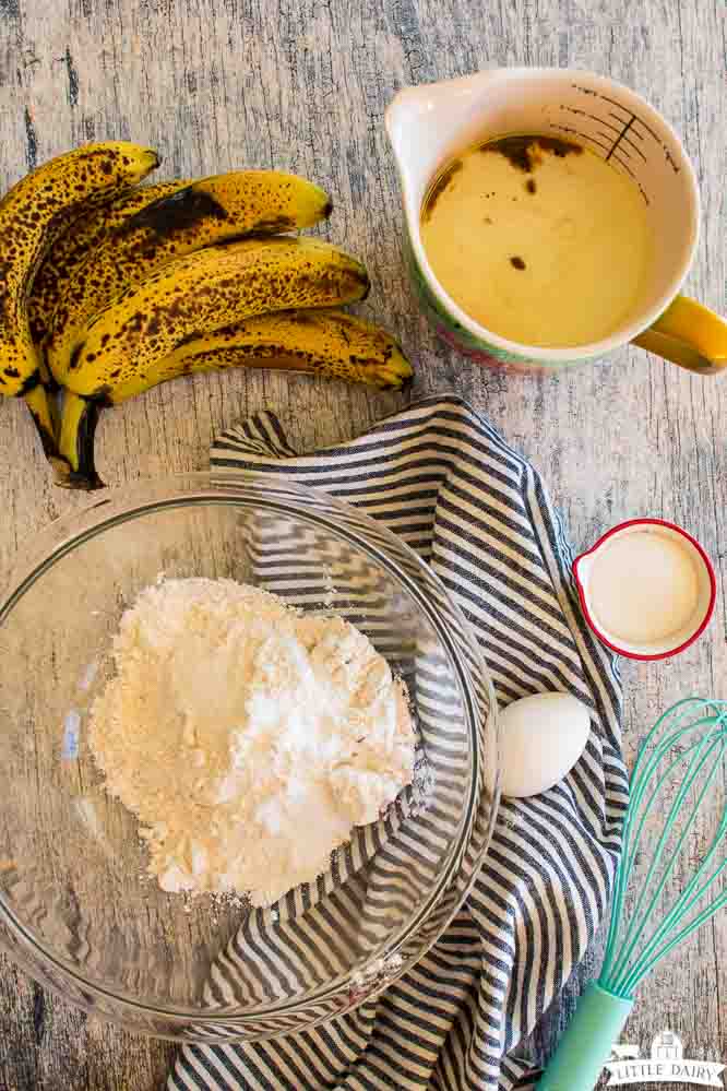 ingredients used to make banana pancakes recipe; dry ingredients, and egg, sugar, buttermilk, oil, vanilla, and bananas