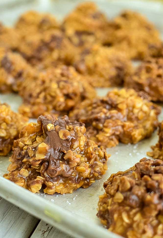 a baking sheet with caramel no bake cookies on it