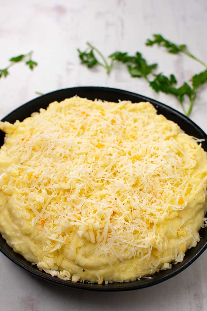mashed potatoes covered with grated cheese