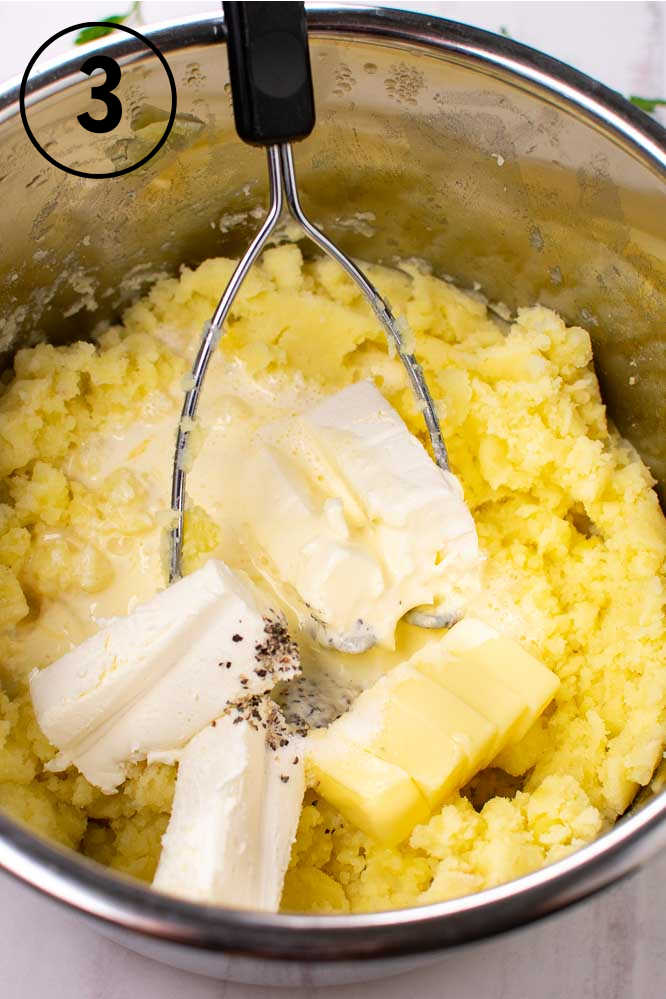 a pressure cooker with mashed potatoes, cream cheese, butter, and cream