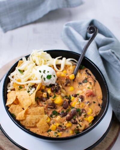 Slow Cooker chicken chili with corn, beans, and cream cheese. Southwest seasonings.