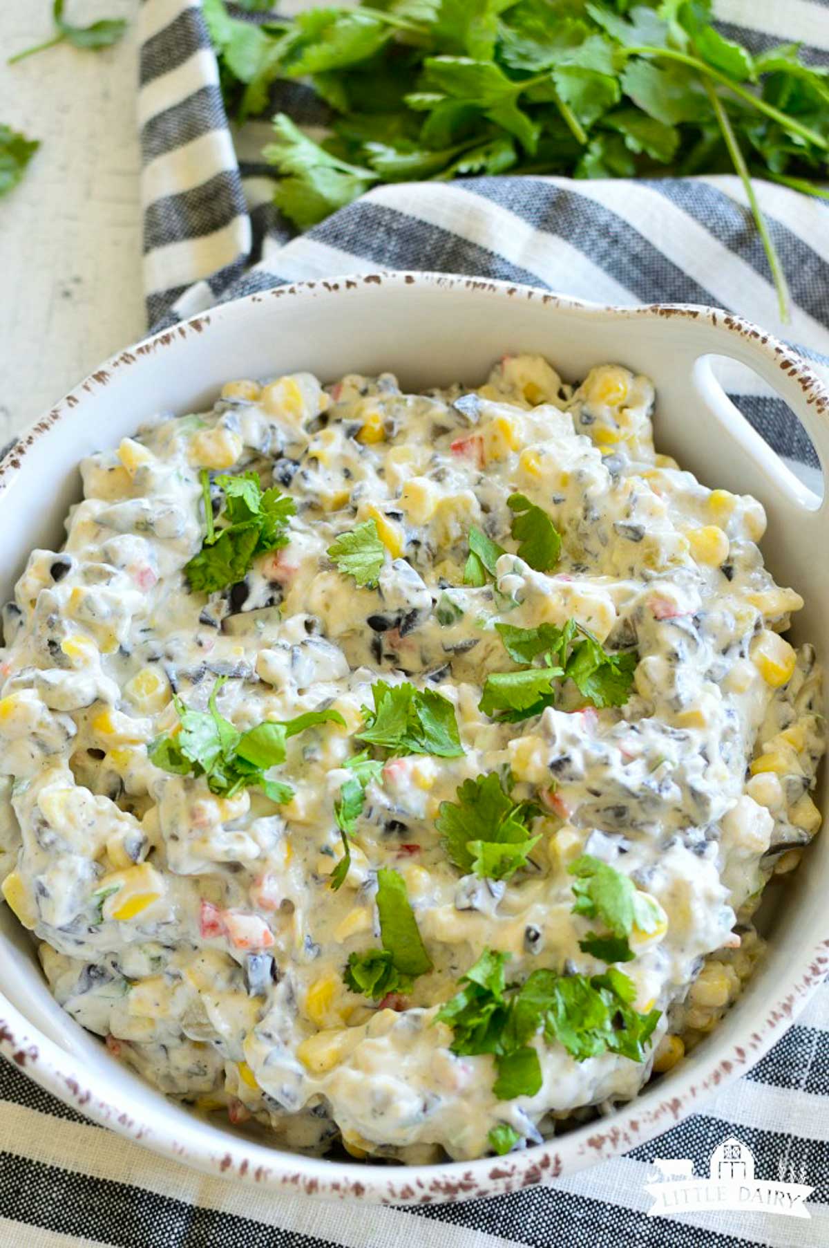 Veggie ranch dip with corn, beans, and herbs.