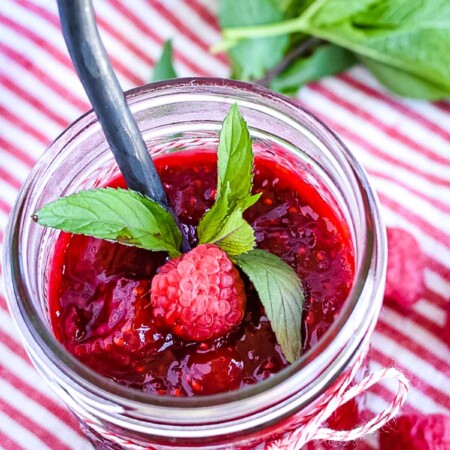 A jar of raspberry dessert topping.