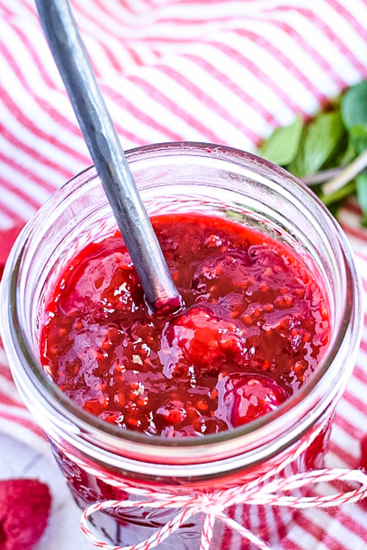 A jar of raspberry sauce.