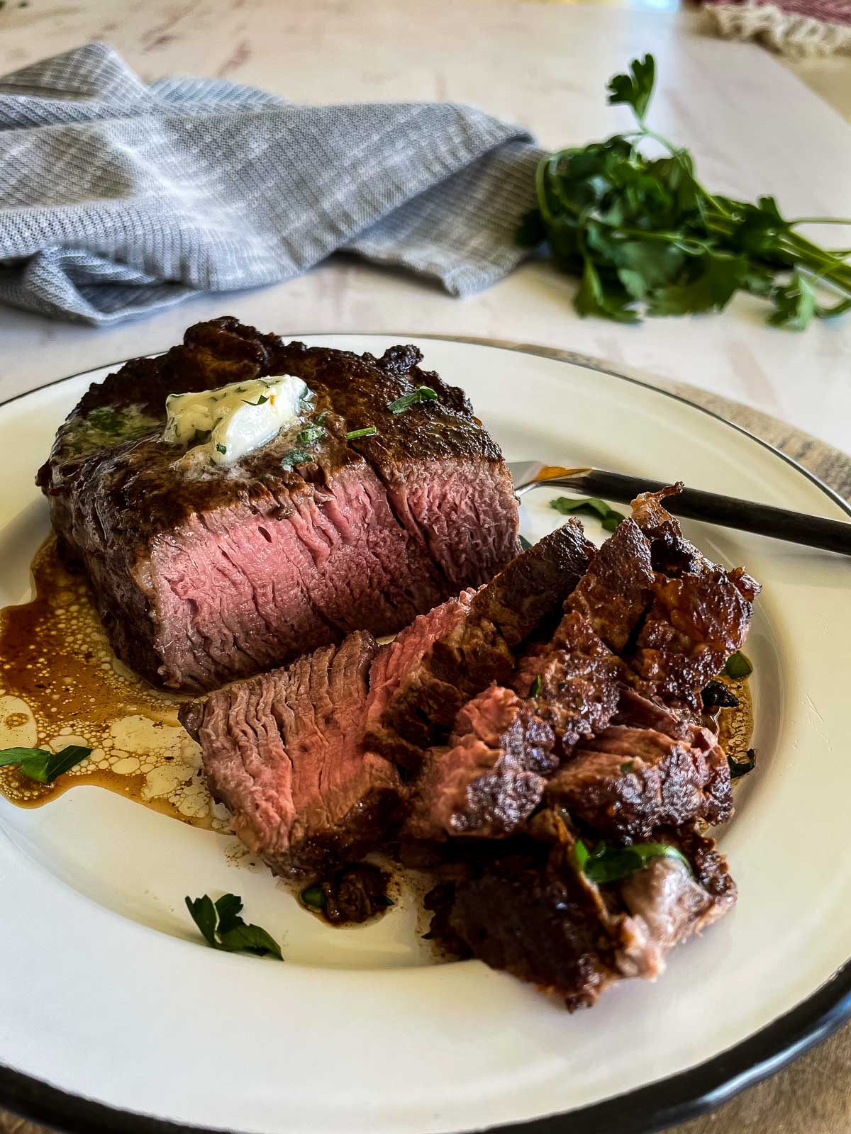 Cooked and sliced beef tenderloin steaks cut into slices.