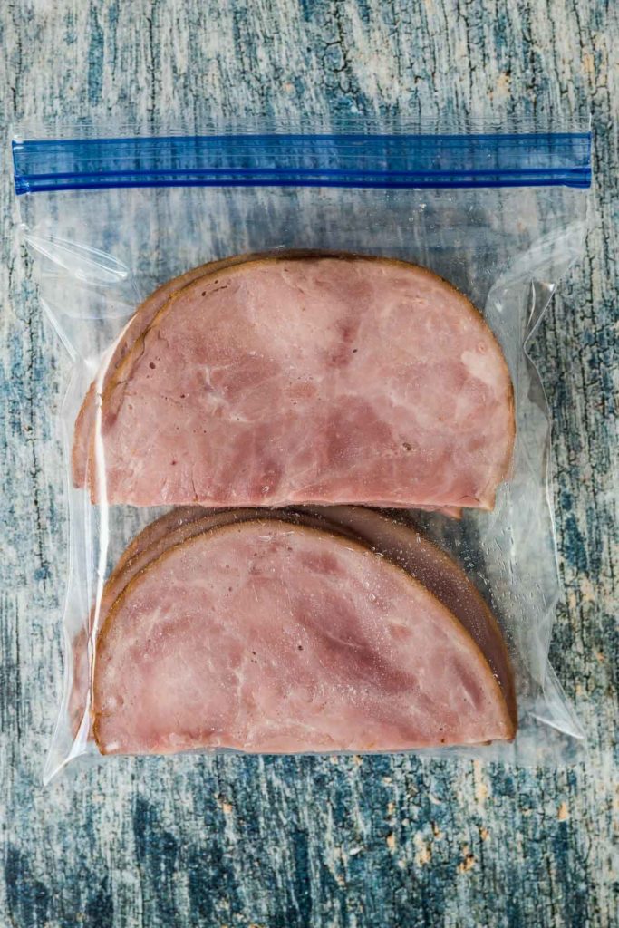 Cooked ham to freeze in a container.