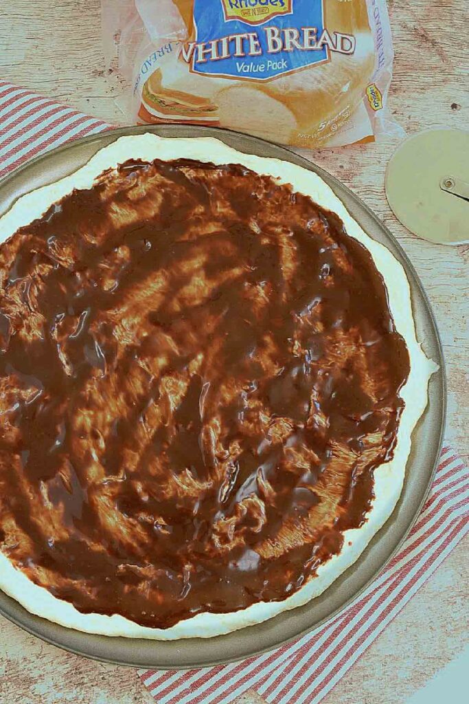 Pizza crust with chocolate sauce.