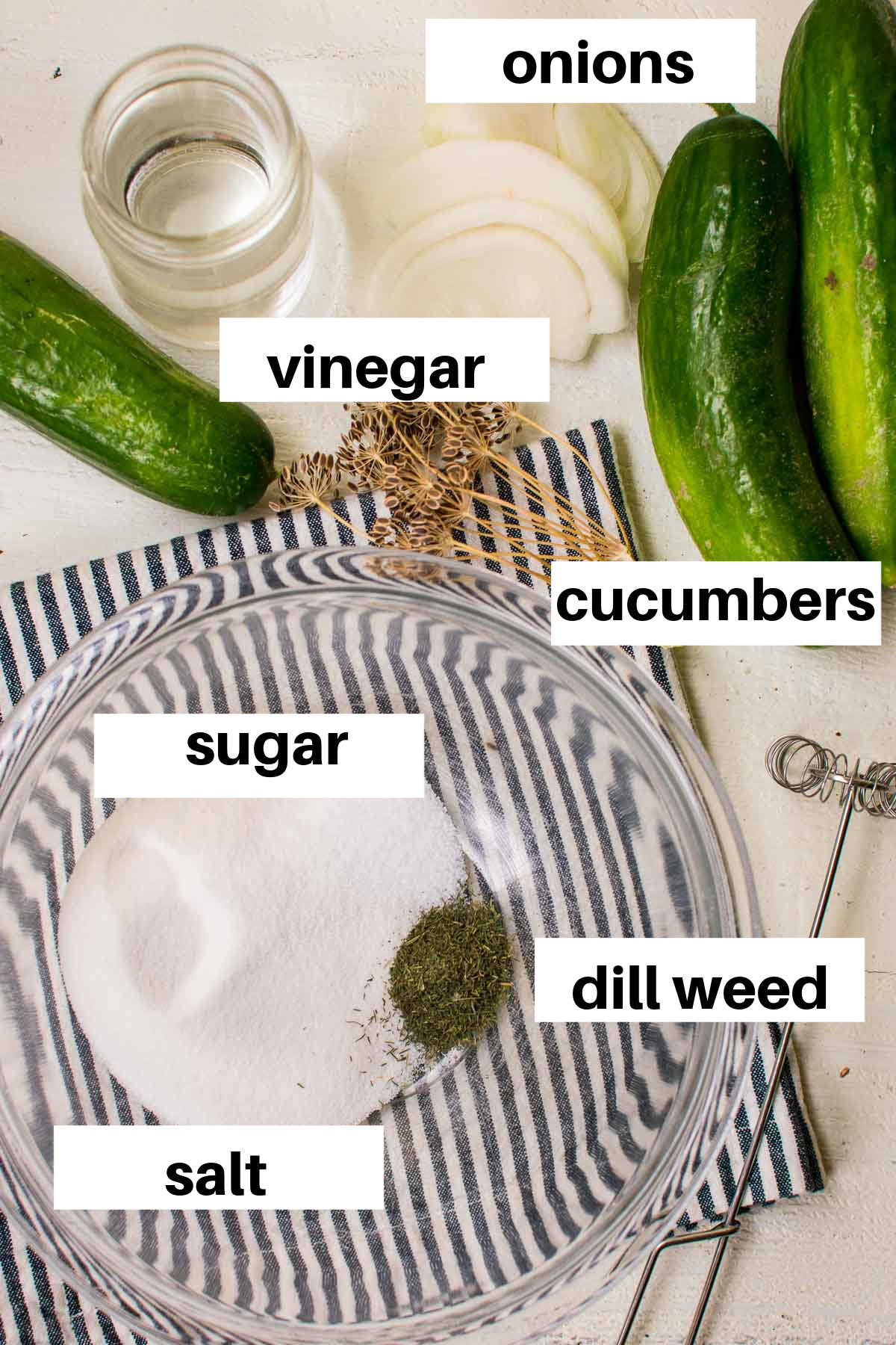Ingredients needed to make fresh pickles with labels.