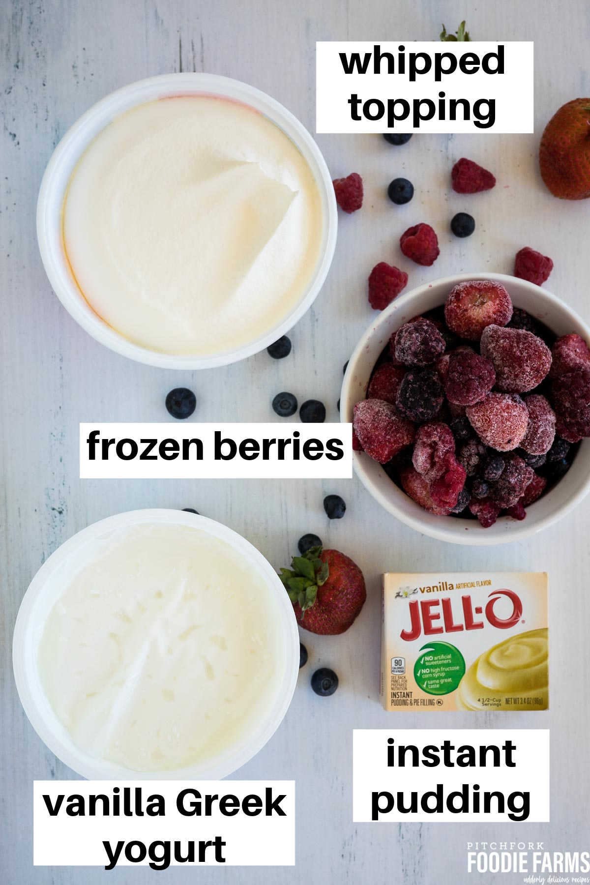 An image with ingredients needed to make cheesecake salad; frozen berries, vanilla yogurt, pudding mix, and whipped topping.