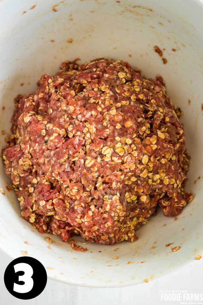 A white bowl with ground beef mixed with oatmeal and seasonings.