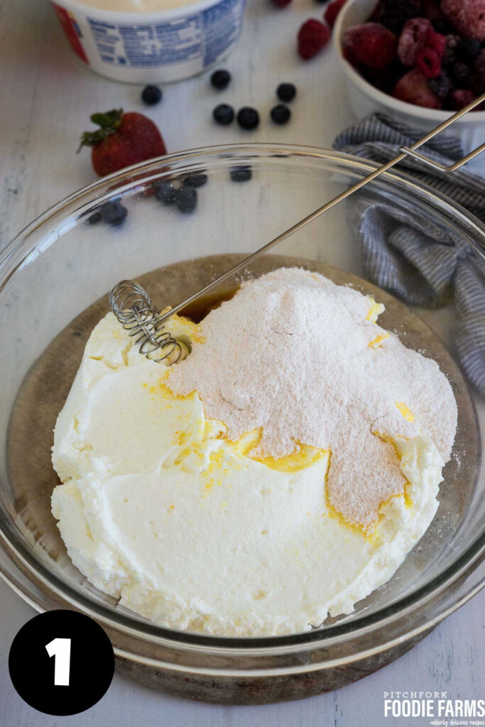 Vanilla yogurt with dry vanilla pudding mix in a mixing bowl.