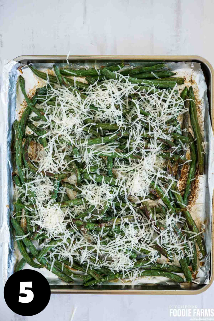 Roasted green beans with grated parmesan cheese on top.