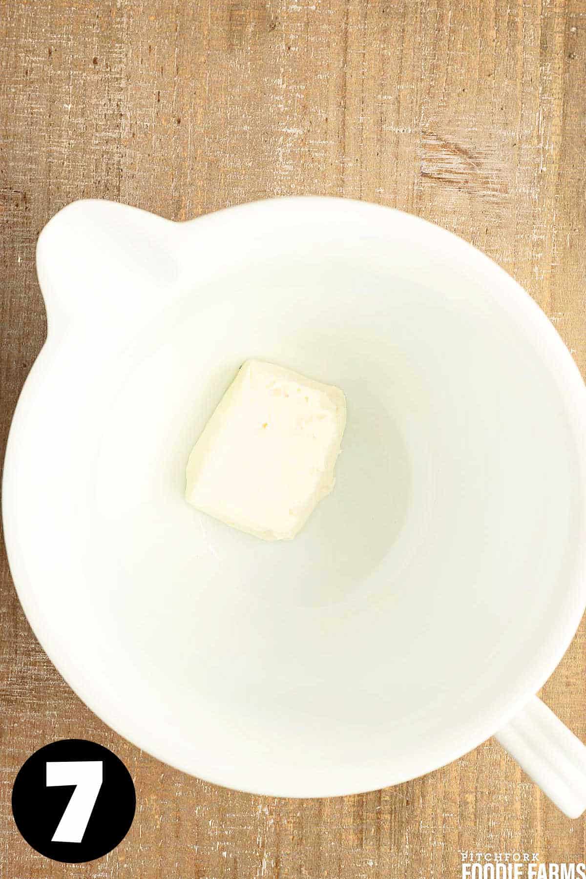 Cream cheese in a white bowl.