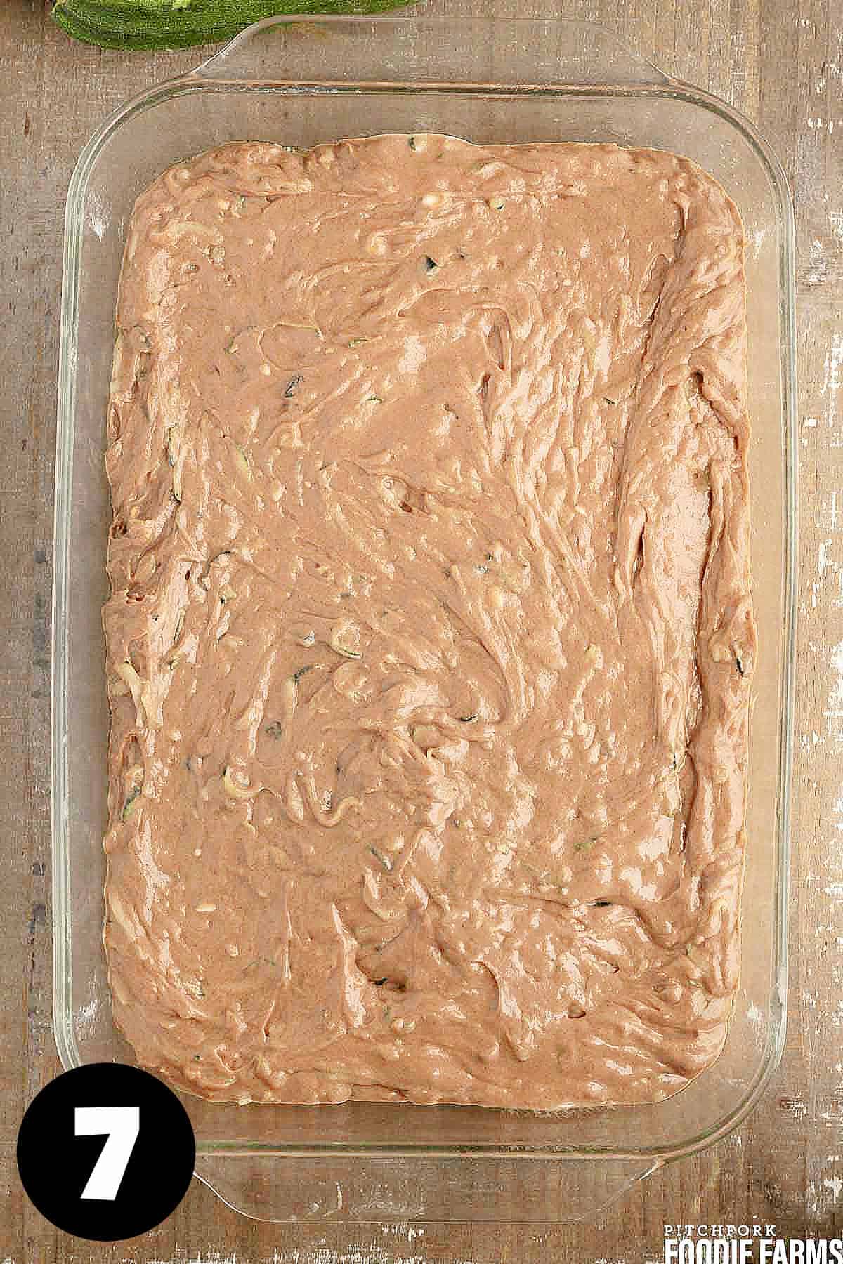 A chocolate cake in a baking pan.