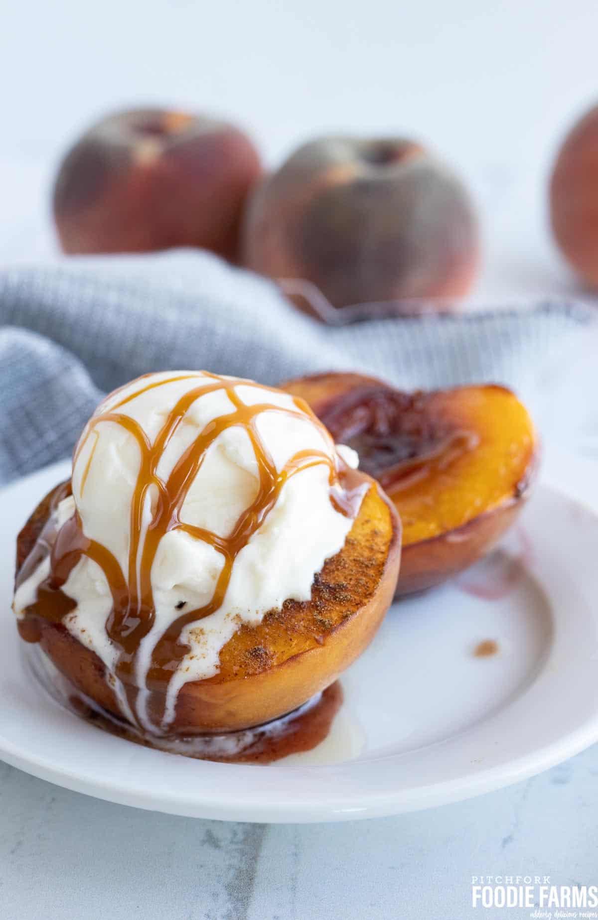 Peaches and ice cream with caramel sauce.