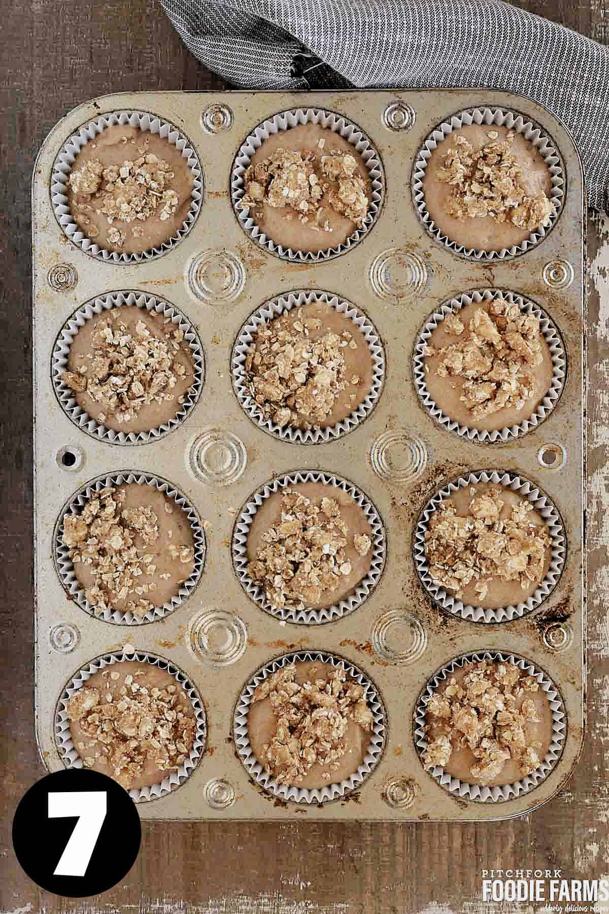 Unbaked muffins in muffin pan.